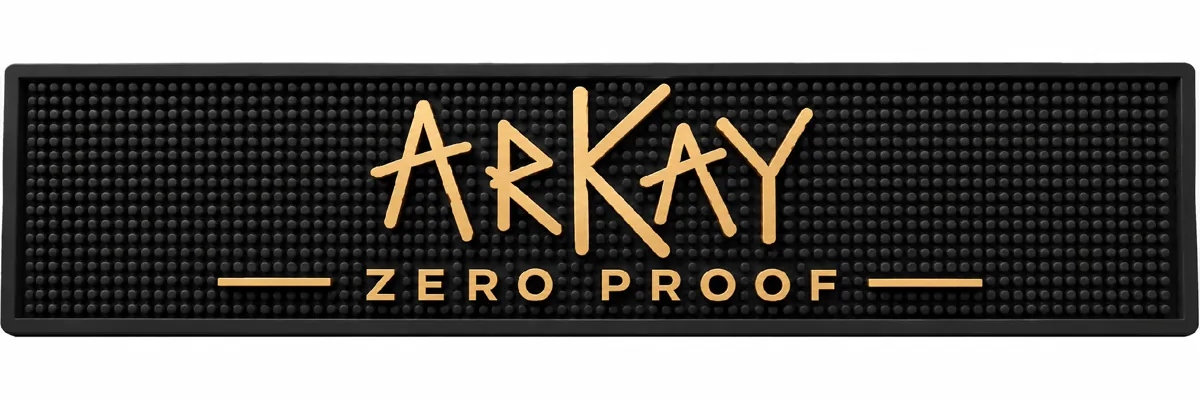 A black rubber bar mat with the ARKAY Zero Proof logo in gold