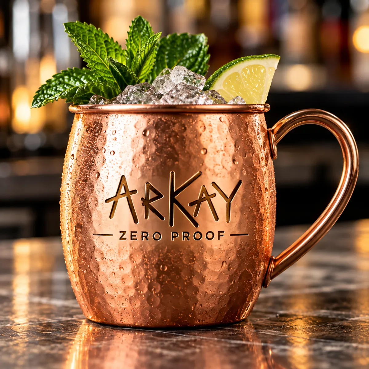 An ARKAY branded copper mule mug with mint and lime