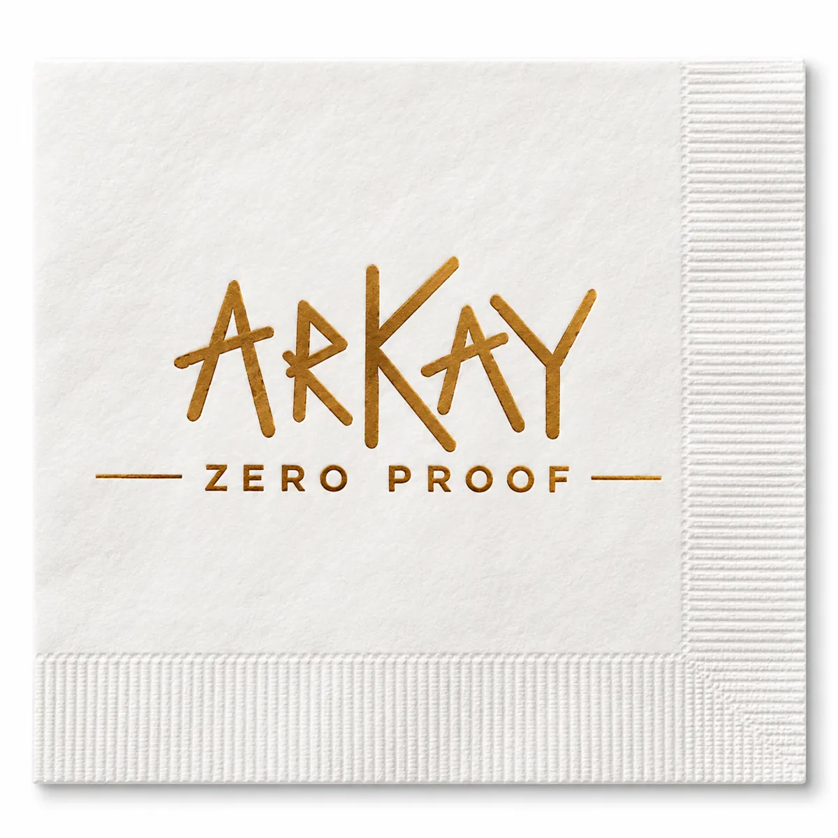 A white cocktail napkin printed with the ARKAY Zero Proof logo in gold